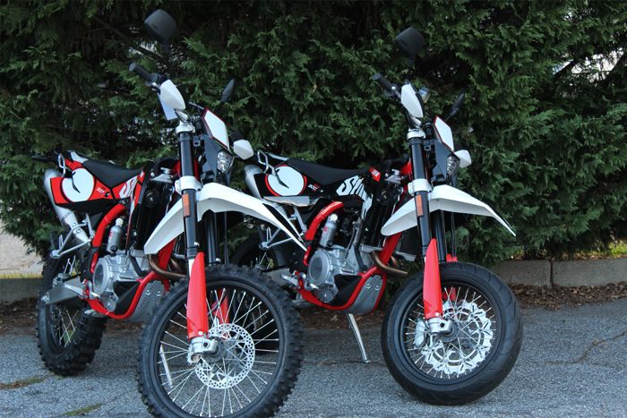 A group of motorcycles parked next to each other.