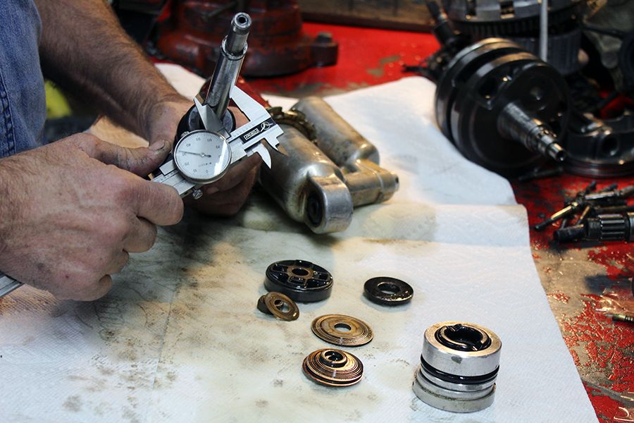 A person working on some parts of a camera